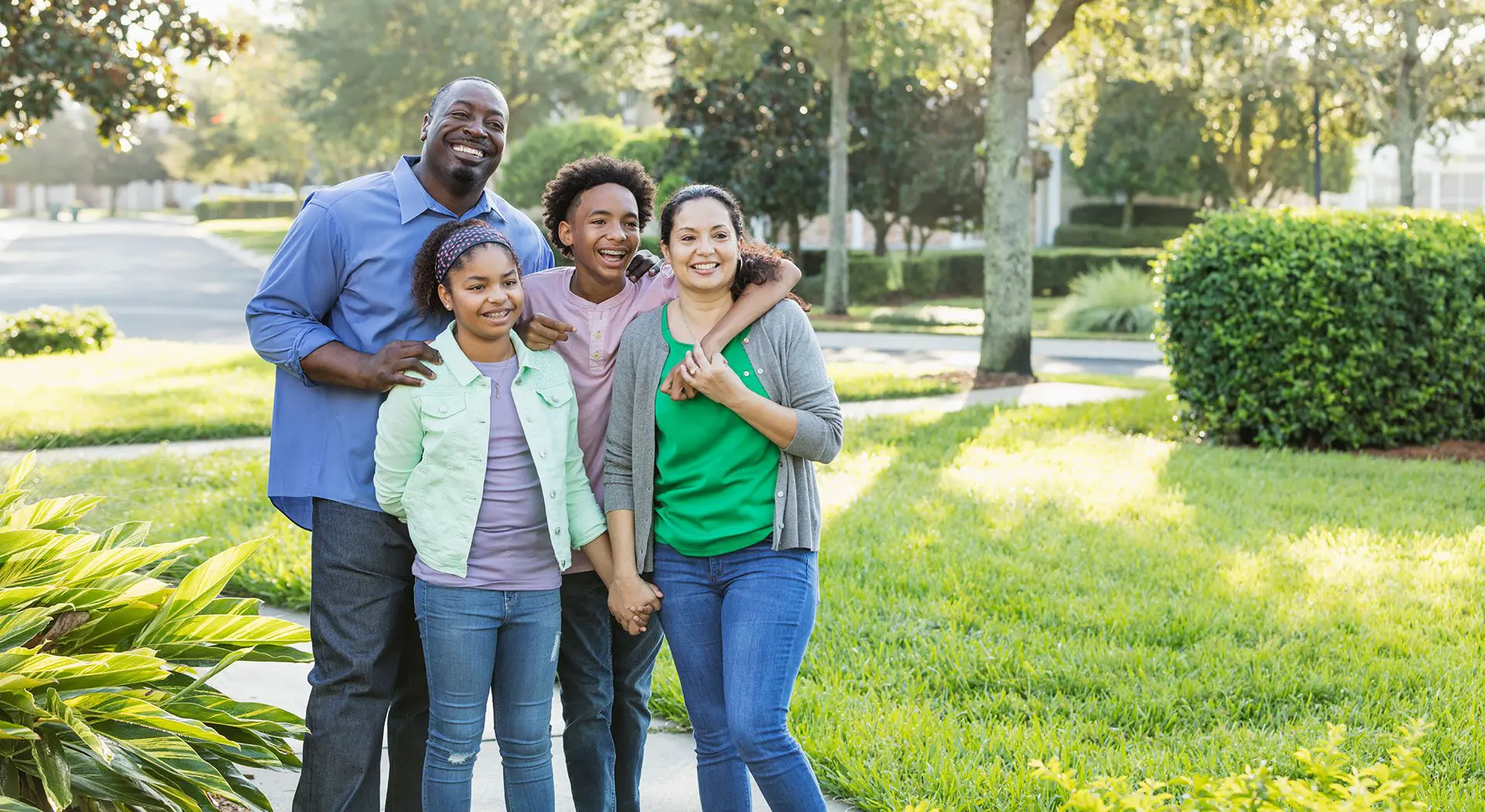 Family smiling after successful orthodontic treatment at Levine Orthodontics in Fort Myers, Cape Coral and Lehigh Acres, FL.