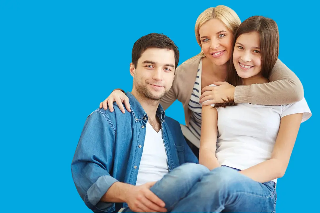 At Levine Orthodontics in Fort Myers, Cape Coral or Lehigh Acres, FL, two women and a man sit closely together, smiling confidently—reflecting the benefits of a great smile and an affordable braces payment plan.