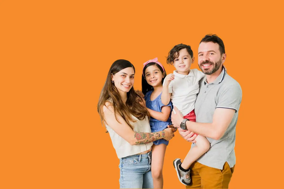 A family of four—two adults and two children—shows off their confident Invisalign smiles in front of a plain orange background, thanks to treatment at Levine Orthodontics in Fort Myers, Cape Coral or Lehigh Acres, FL.