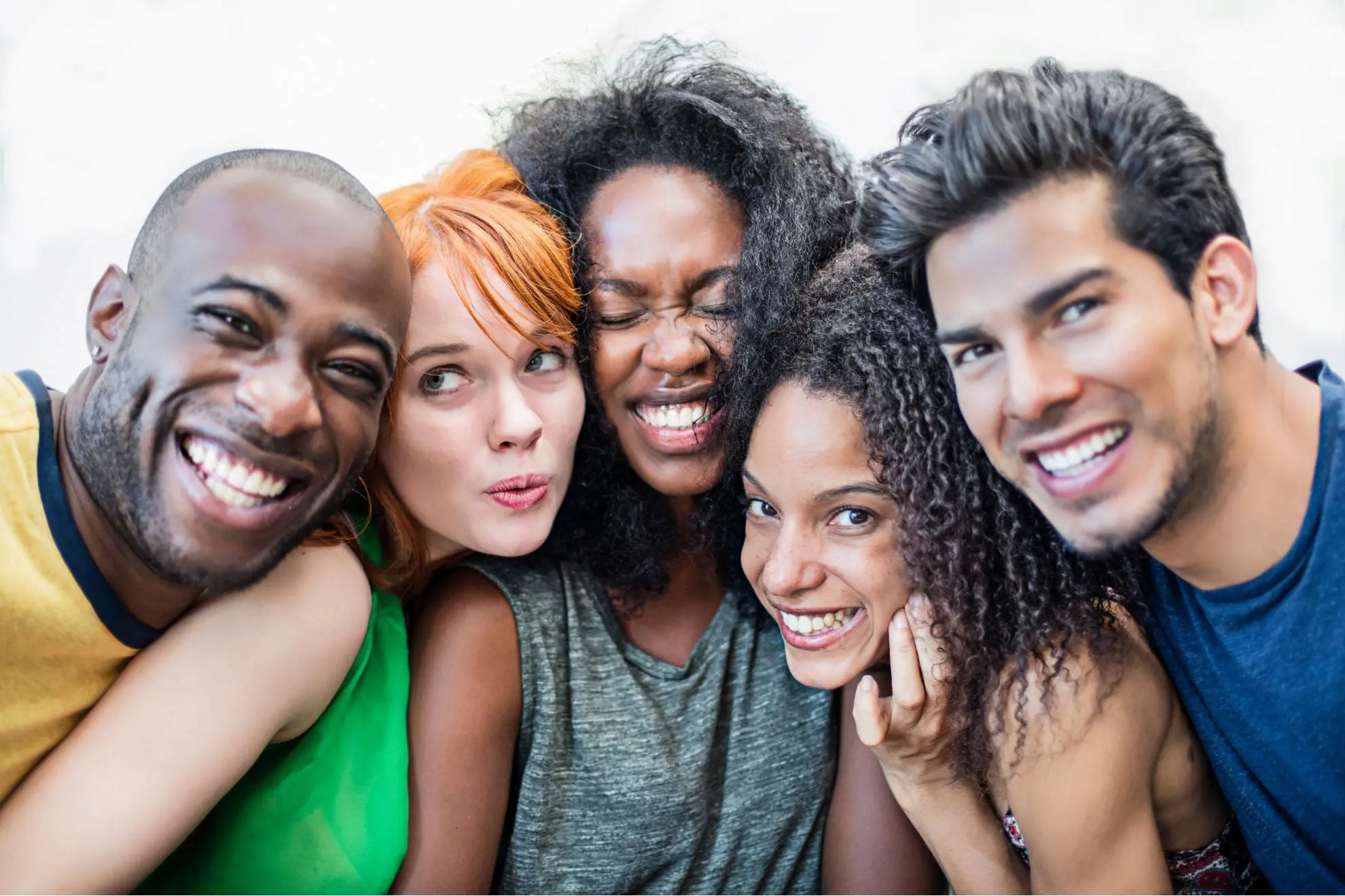 A group of smiling friends celebrating their new Invisalign aligners, happy with the affordable pricing and flexible payment options from Levine Orthodontics in Fort Myers, FL.