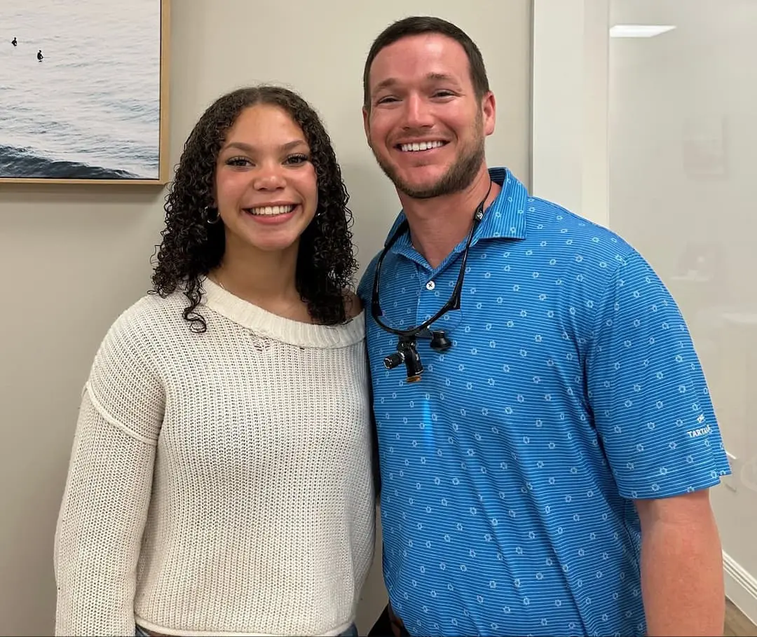 Dr. Levine with a happy patient celebrating their new confident smile after expert orthodontic treatment with braces, Invisalign, clear aligners, and orthodontic appliances at Levine Orthodontics in Fort Myers, Cape Coral, and Lehigh Acres, FL.
