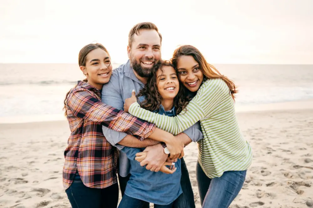 Parents with their children learning about orthodontic insurance coverage and treatment options at Levine Orthodontics in Fort Myers, Cape Coral, and Lehigh Acres, FL. Understanding how age limits on certain dental plans may affect braces and Invisalign coverage with help from the orthodontic team.
